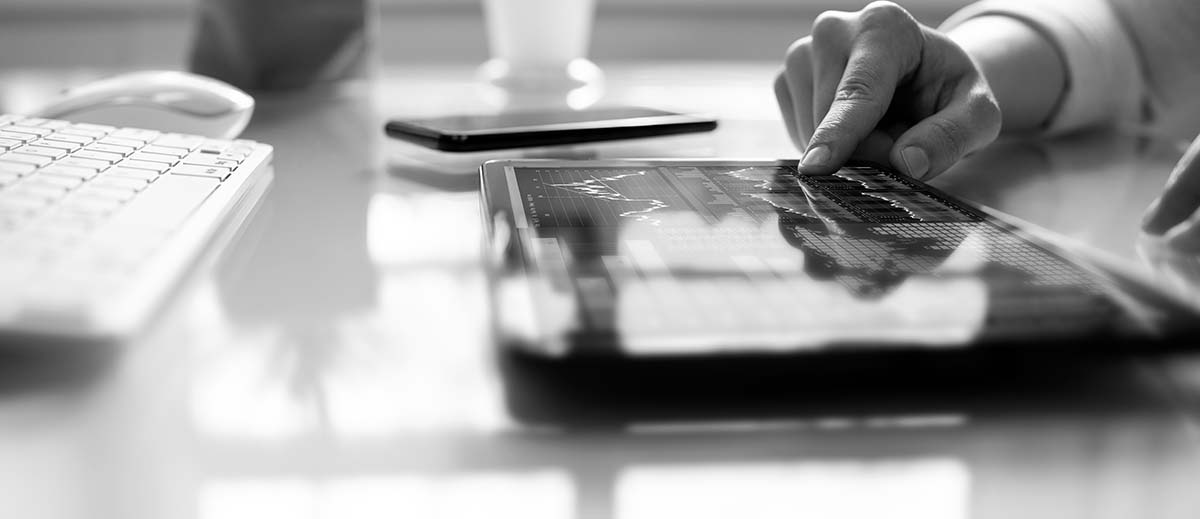 man tapping an ipad